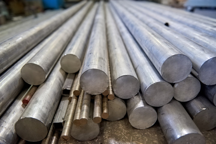 Steel round bars stacked in warehouse – CoreMet Steel precision-engineered bar products