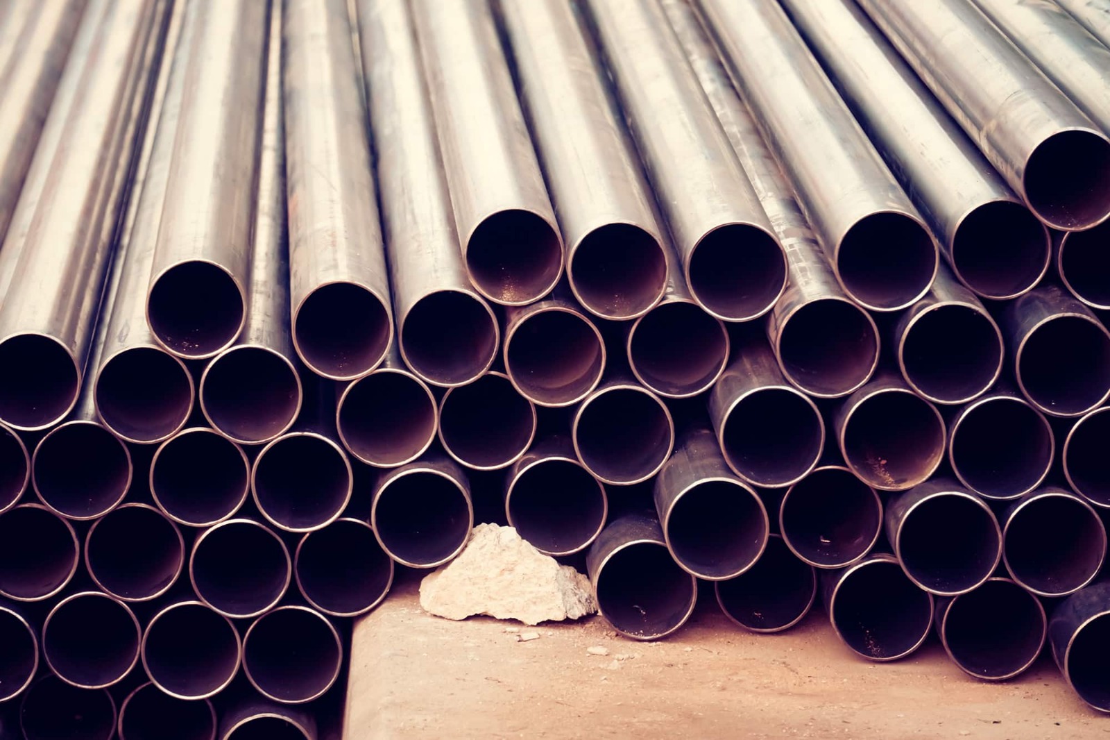 Nominal bore steel tubes (NB pipes) stacked in warehouse – CoreMet Steel supplier